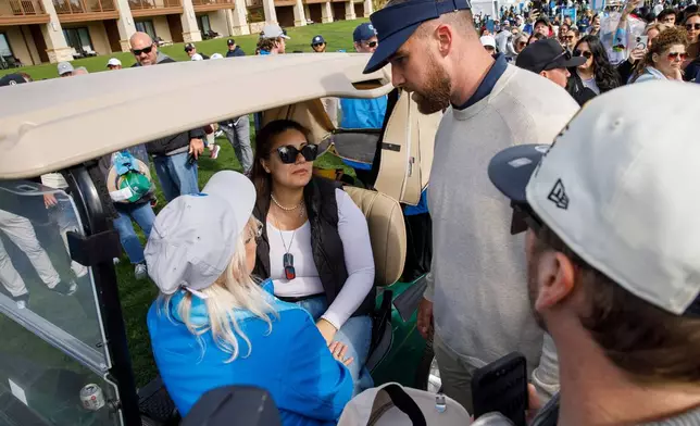 Travis Kelce of the Kansas City Chiefs checks on Edenne Flinn — who was hit in the head by Kelce's golf ball during play — on the 18th hole in the second round of the AT&amp;T Pebble Beach Pro-Am in Pebble Beach, Calif., on Friday, Feb. 13, 2026. (Santiago Mejia/San Francisco Chronicle via AP)