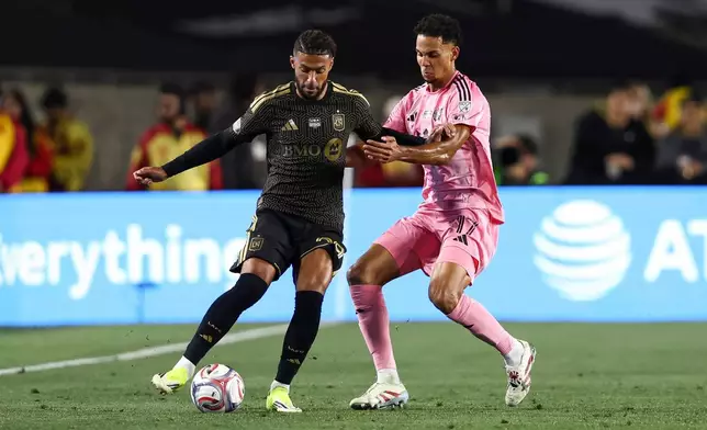 Los Angeles FC forward Denis Bouanga, left, dribbles against Inter Miami defender Ian Fray (17) during the first half of an MLS soccer match, Saturday, Feb. 21, 2026, in Los Angeles, Calif. (AP Photo/Jessie Alcheh)
