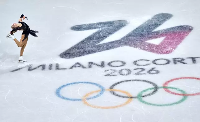 Amber Glenn of the United States competes during the figure skating women's team event at the 2026 Winter Olympics, in Milan, Italy, Sunday, Feb. 8, 2026. (AP Photo/Natacha Pisarenko)