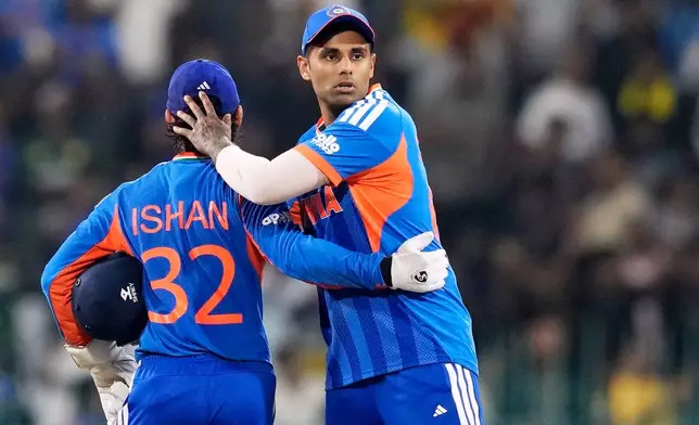 India's captain Suryakumar Yadav, right, and Ishan Kishan celebrate after India won their T20 World Cup cricket match against Pakistan in Colombo, Sri Lanka, Sunday, Feb. 15, 2026. (AP Photo/Eranga Jayawardena)