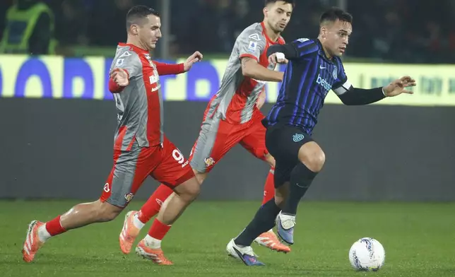 Inter's Lautaro Martinez, right, controls the ball during the Serie A soccer match between Cremonese and Inter in Cremona, Italy, Sunday, Feb. 2026. (Alberto Mariani/LaPresse via AP)