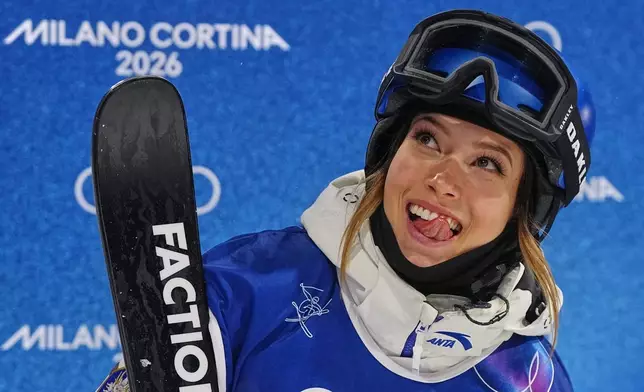 China's Eileen Gu reacts during the women's freestyle skiing halfpipe qualifications at the 2026 Winter Olympics, in Livigno, Italy, Thursday, Feb. 19, 2026. (AP Photo/Gregory Bull)