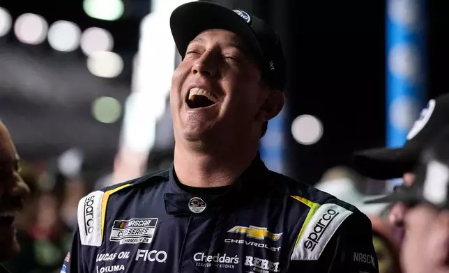 Kyle Busch speaks with his crew during NASCAR Daytona 500 qualifying, Wednesday, Feb. 11, 2026, in Daytona, Fla. (AP Photo/Mike Stewart)