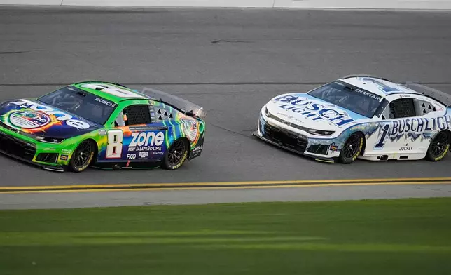 Kyle Busch, (8) and Ross Chastain, (1) run during practice at the NASCAR Daytona 500 auto races at Daytona International Speedway, Friday, Feb. 13, 2026, in Daytona Beach, Fla. (AP Photo/Mike Stewart)