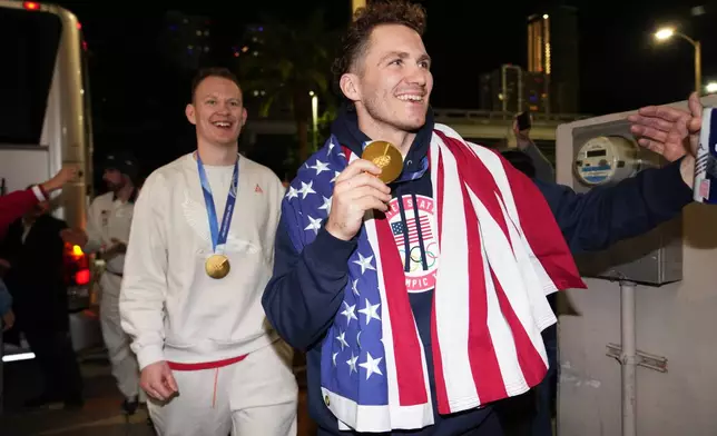 United States hockey player Matthew Tkachuk arrives at E11EVEN after the team won the gold medal at the Milan Cortina Olympics, Monday, Feb. 23, 2026, in Miami. (AP Photo/Lynne Sladky)