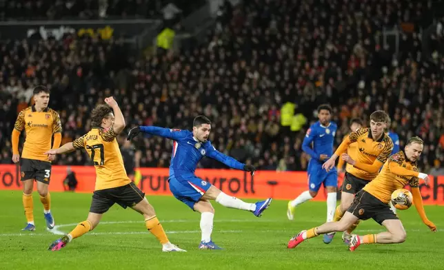 Chelsea's Pedro Neto shoots during the English FA Cup fourth round soccer match between Hull City and Chelsea in Hull, England, Friday, Feb. 13, 2026. (AP Photo/Jon Super)