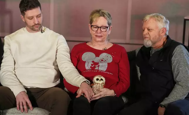 From left, Brent Ganger consoles his mother, Donna, and father, Tim Ganger, parents of Renee Good, during an interview in Denver, on Friday, Feb. 27, 2026. (AP Photo/David Zalubowski)