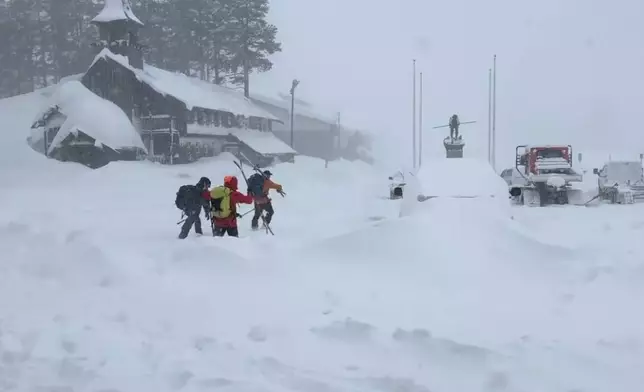 This image provided by the Nevada County Sheriff's Office shows members of a rescue team in Soda Springs, California on Tuesday, Feb. 17, 2026. (Nevada County Sheriff's Office via AP)