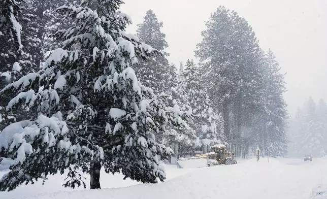 A road is plowed during a snow storm on Tuesday, Feb. 17, 2026 in Truckee Calif. (AP Photos/Brooke Hess-Homeier)