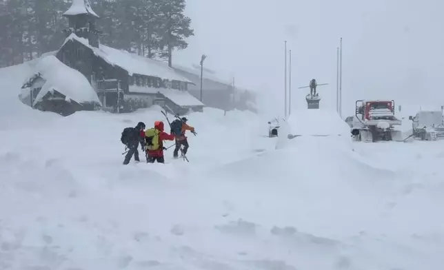This image provided by the Nevada County Sheriff's Office shows members of a rescue team in Soda Springs, California on Tuesday, Feb. 17, 2026. (Nevada County Sheriff's Office via AP)