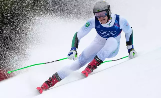 Brazil's Lucas Pinheiro Braathen speeds down the course, during an alpine ski, men¥s giant slalom race, at the 2026 Winter Olympics, in Bormio, Italy, Saturday, Feb. 14, 2026. (AP Photo/John Locher)