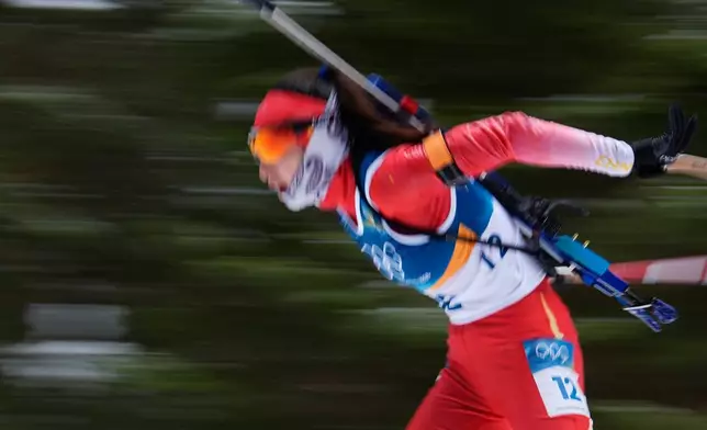 Meng Fanqi, of China, competes during the women's 7.5-kilometer sprint biathlon race at the 2026 Winter Olympics in Anterselva, Italy, Saturday, Feb. 14, 2026. (AP Photo/Mosa'ab Elshamy)