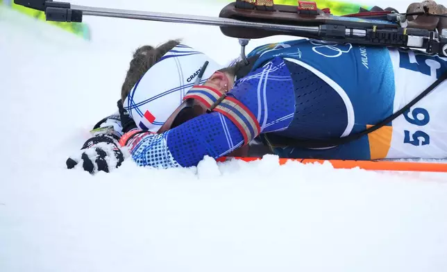 Silver medalist Oceane Michelon, of France, reacts after the women's 7.5-kilometer sprint biathlon race at the 2026 Winter Olympics in Anterselva, Italy, Saturday, Feb. 14, 2026. (AP Photo/Andrew Medichini)