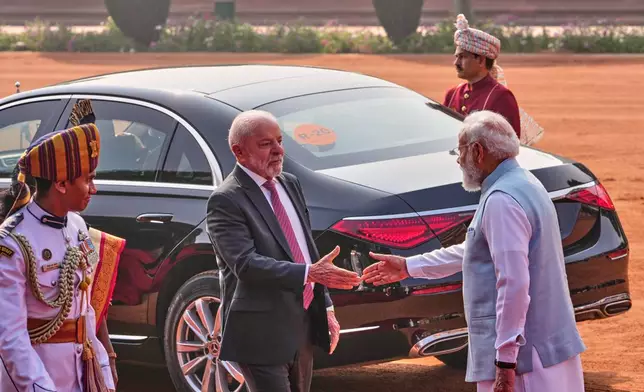 Brazilian President Luiz Inacio Lula da Silva shakes hands with India Prime Minister Narendra Modi, right, upon his arrival at the Indian Presidential Palace for his ceremonial reception in New Delhi, India, Saturday, Feb. 21, 2026. (AP Photo/Manish Swarup)