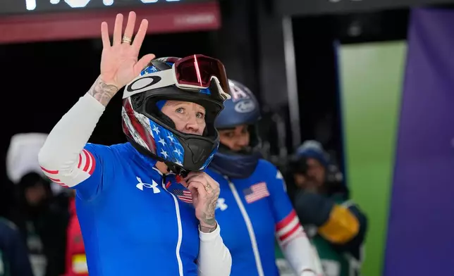 United States' Kaillie Armbruster Humphries, left, and Jasmine Jones, right, arrive at the finish during a two women bobsled run at the 2026 Winter Olympics, in Cortina d'Ampezzo, Italy, Saturday, Feb. 21, 2026. (AP Photo/Alessandra Tarantino)