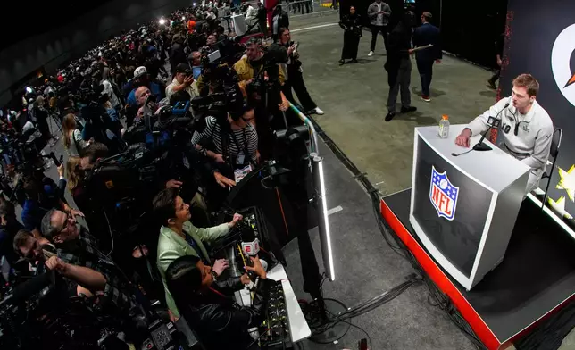 New England Patriots quarterback Drake Maye speaks during the NFL Super Bowl Opening Night, Monday, Feb. 2, 2026, in San Jose, Calif., ahead of the Super Bowl 60 football game between the Seattle Seahawks and the New England Patriots. (AP Photo/Charlie Riedel)