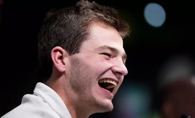 New England Patriots quarterback Drake Maye laughs during the NFL Super Bowl Opening Night, Monday, Feb. 2, 2026, in San Jose, Calif. ahead of the Super Bowl 60 football game between the New England Patriots and the Seattle Seahawks. (AP Photo/Brynn Anderson)