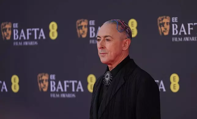 Alan Cumming poses for photographers upon arrival at the 79th British Academy Film Awards, BAFTA's, in London, Sunday, Feb. 22, 2026. (AP Photo/Alberto Pezzali)
