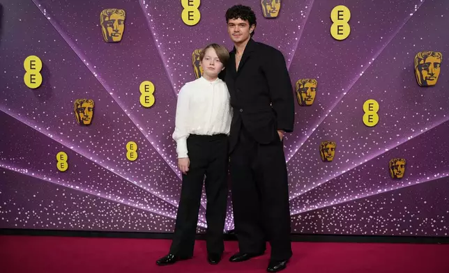 Jacobi Jupe, left and Noah Jupe pose for photographers upon arrival at the 79th British Academy Film Awards, BAFTA's, in London, Sunday, Feb. 22, 2026. (AP Photo/Alastair Grant)