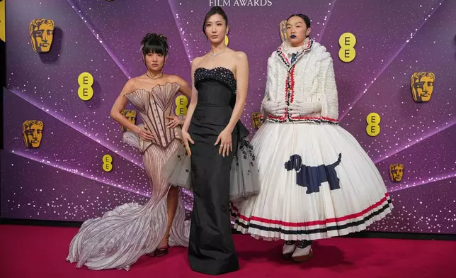 Ejae, from left Audrey Nuna and Rei Ami pose for photographers upon arrival at the 79th British Academy Film Awards, BAFTA's, in London, Sunday, Feb. 22, 2026. (AP Photo/Alastair Grant)