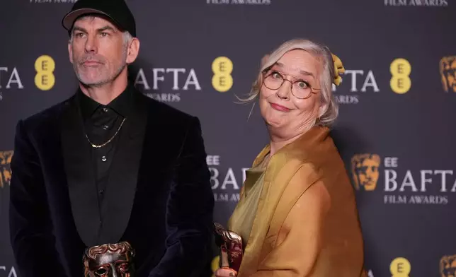 Shane Vieau, Tamara Deverell pose with the award for production design for 'Frankenstein'at the 79th British Academy Film Awards, BAFTA's, in London, Sunday, Feb. 22, 2026. (AP Photo/Alastair Grant)