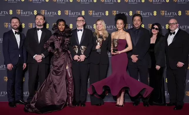 Andy Jurgensen, from left, Leonardo DiCaprio, Teyana Taylor, Paul Thomas Anderson, Sara Murphy, Chase Infiniti, Benicio Del Toro, Cassandra Kulukundis, and Michael Bauman pose with the awards for best director, cinematography, and adapted screenplay for 'One Battle After Another' at the 79th British Academy Film Awards, BAFTA's, in London, Sunday, Feb. 22, 2026. (AP Photo/Alastair Grant)