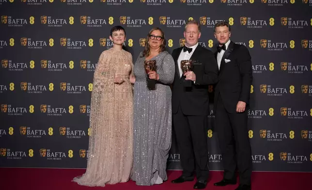 Ginnifer Goodwin, from left, Yvett Merino, Jared Bush, and Josh Dallas pose with the award for animated film for 'Zootopia 2'at the 79th British Academy Film Awards, BAFTA's, in London, Sunday, Feb. 22, 2026. (AP Photo/Alastair Grant)
