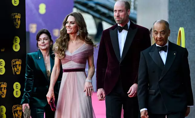 Britain's Prince William and Kate, Princess of Wales arrive with Jane Millichip, CEO of the British Academy of Film and Television Arts and Lord-Lieutenant of Greater London Ken Olisa to the 79th British Academy Film Awards, at the Royal Festival Hall, in London, Sunday Feb. 22, 2026. (Jaimi Joy/Pool Photo via AP)