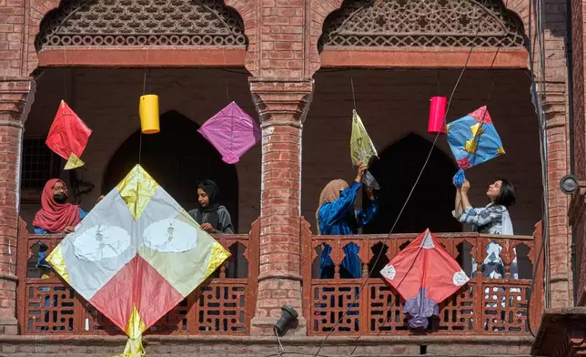Students decorate their university campus with a variety of kites ahead of the upcoming three-day kite flying festival 'Basant' celebrations, in Lahore, Pakistan, Thursday, Feb. 5, 2026. (AP Photo/K.M. Chaudary)