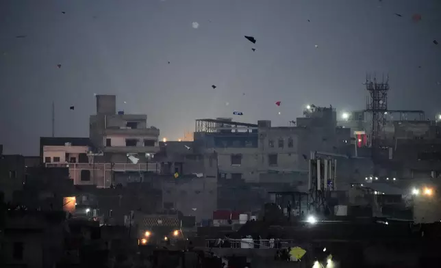 Kites fill the sky as people celebrate the three-day kite flying festival 'Basant', in Lahore, Pakistan, Friday, Feb. 6, 2026. (AP Photo/K.M. Chaudary)