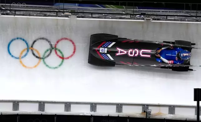 United States' Elana Meyers Taylor slides down the track during a women's monobob run at the 2026 Winter Olympics, in Cortina d'Ampezzo, Italy, Monday, Feb. 16, 2026. (AP Photo/Alessandra Tarantino)