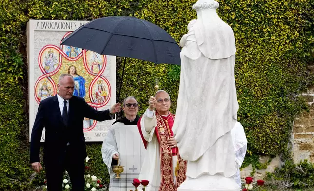 Pope Leo XIV blesses a mosaic of the Virgin Mary and a statue of St. Rose of Lima in the Vatican Gardens, Saturday, Jan. 31, 2026. (AP Photo/Andrew Medichini)