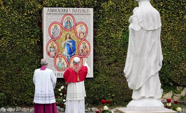 Pope Leo XIV blesses a mosaic of the Virgin Mary and a statue of St. Rose of Lima in the Vatican Gardens, Saturday, Jan. 31, 2026. (AP Photo/Andrew Medichini)