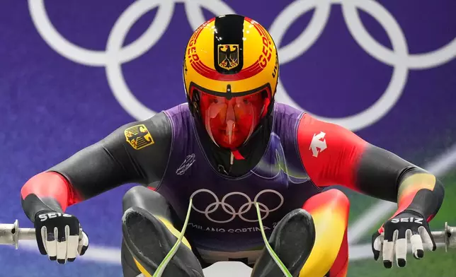 Germany's Max Langenhan prepares for a men's single luge run at the 2026 Winter Olympics, in Cortina d'Ampezzo, Italy, Saturday, Feb. 7, 2026. (AP Photo/Alessandra Tarantino)