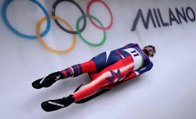 United States' Jonathan Gustafson slides down the track during a men's single luge run at the 2026 Winter Olympics, in Cortina d'Ampezzo, Italy, Saturday, Feb. 7, 2026. (AP Photo/Aijaz Rahi)