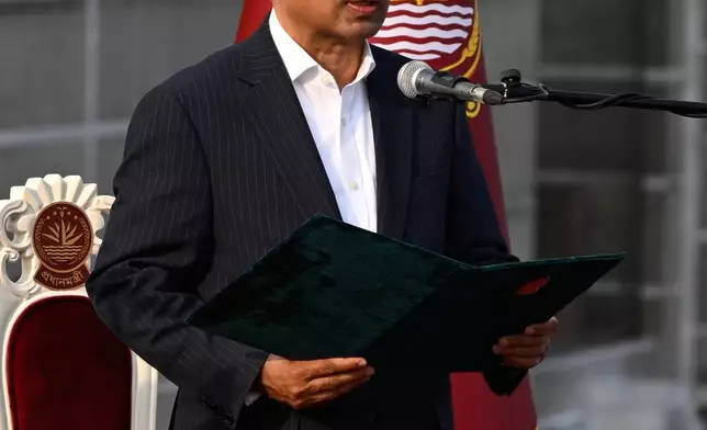 Tarique Rahman, Chairperson of the Bangladesh Nationalist Party, takes oath as Prime Minister of Bangladesh from President Mohammed Shahabuddin during a ceremony at the National Parliament in Dhaka, Bangladesh, Tuesday, Feb.17, 2026. (AP Photo/Mahmud Hossain Opu)