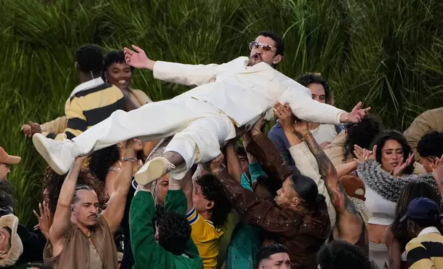 Bad Bunny performs during halftime of the NFL Super Bowl 60 football game between the New England Patriots and the Seattle Seahawks, Sunday, Feb. 8, 2026, in Santa Clara, Calif. (AP Photo/Charlie Riedel)