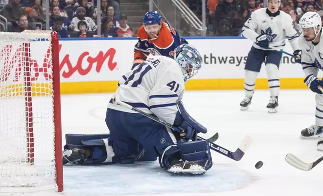 Toronto Maple Leafs' goalie Anthony Stolarz (41) makes a save on Edmonton Oilers' Leon Draisaitl (29) during the second period of an NHL game in Edmonton, Tuesday, Feb. 3, 2026. (Jason Franson/The Canadian Press via AP)
