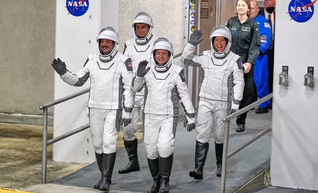 Crew 12 astronauts, from left, pilot Jack Hathaway, Russian cosmonaut Andrei Fedyaev, commander Jessica Meir and ESA astronaut Sophia Adenot, of France, leave the Operations and Checkout building before heading to pad 40 at the Cape Canaveral Space Force Station in Cape Canaveral, Fla., Friday, Feb. 13, 2026, on a mission to the International Space Station. (AP Photo/John Raoux)