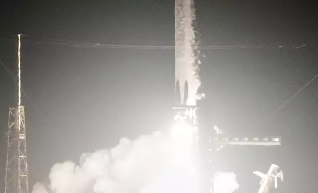 A SpaceX Falcon 9 rocket with a crew of four aboard the Dragon space craft lifts off from pad 40 at the Cape Canaveral Space Force Station in Cape Canaveral, Fla., Friday, Feb. 13, 2026 . (AP Photo/John Raoux)