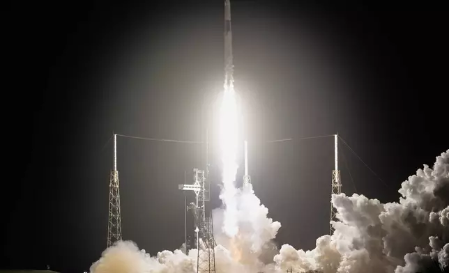 A SpaceX Falcon 9 rocket with a crew of four aboard the Dragon space craft lifts off from pad 40 at the Cape Canaveral Space Force Station in Cape Canaveral, Fla., Friday, Feb. 13, 2026. (AP Photo/John Raoux)