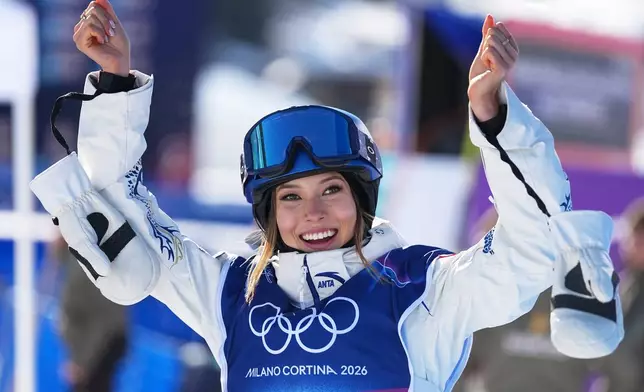 China's Eileen Gu celebrates competes during women's freestyle skiing slopestyle qualifications at the 2026 Winter Olympics, in Livigno, Italy, Saturday, Feb. 7, 2026. (AP Photo/Gregory Bull)