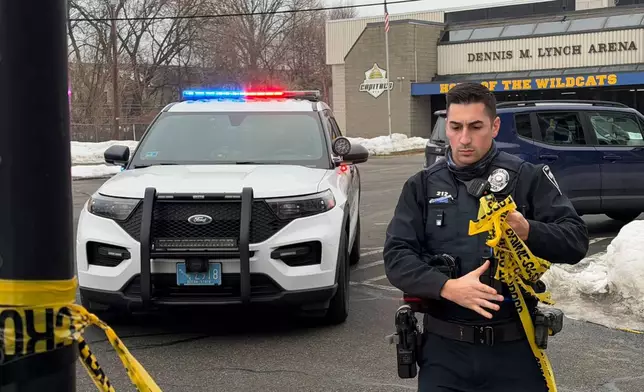 Police continue to tape off the Dennis M. Lynch arena a day after a deadly shooting during a youth hockey game on Tuesday, Feb. 17, 2026 in Pawtucket, R.I. (AP Photo/Rodrique Ngowi)