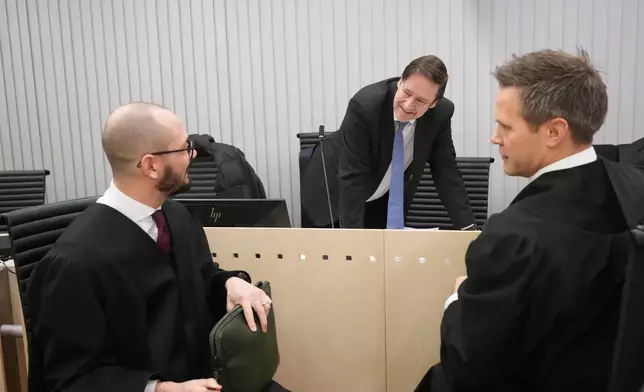 Prosecutor Sturla Henriksbo, right, investigation leader Andreas Kruszewski, left, and defense attorney John Christian Elden, speak during the first day of the trial against Marius Borg Hoiby, charged with a total of 38 incidents, including four rapes, assault, violence, threats, damage, storage and delivery of marijuana, violation of a restraining order and violation of the Road Traffic Act, in Oslo, Norway, Tuesday Feb. 3, 2026.(Ole Berg-Rusten/NTB Scanpix via AP)