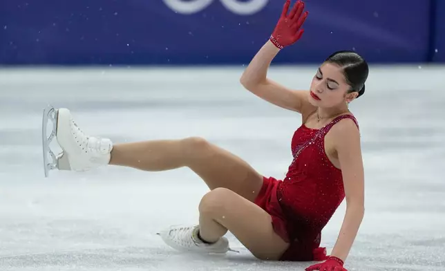 Adeliia Petrosian of Individual Neutral Athletes falls during the women's figure skating free program at the 2026 Winter Olympics, in Milan, Italy, Thursday, Feb. 19, 2026. (AP Photo/Natacha Pisarenko)
