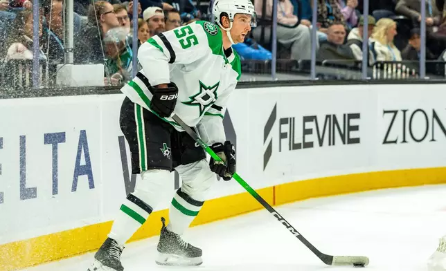 Dallas Stars defenseman Thomas Harley looks to move the puck against the Utah Mammoth during the first period of an NHL hockey game Saturday, Jan. 31, 2026, in Salt Lake City. (AP Photo/Melissa Majchrzak)