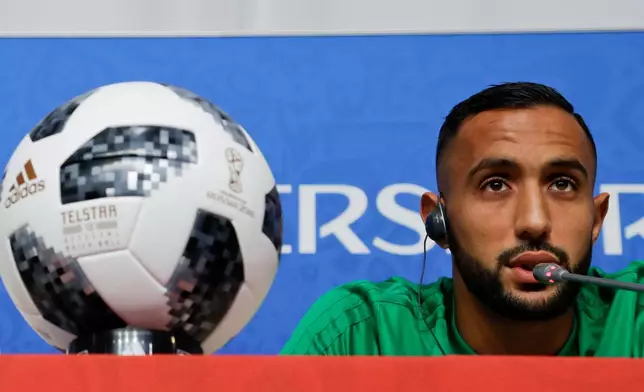 FILE - Medhi Benatia talks to journalists during a news conference in St. Petersburg, Russia, June 14, 2018. (AP Photo/Andrew Medichini)