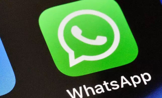 FILE - A WhatsApp icon is displayed on an iPhone, Nov. 15, 2018, in Gelsenkirchen, Germany. (AP Photo/Martin Meissner, File)