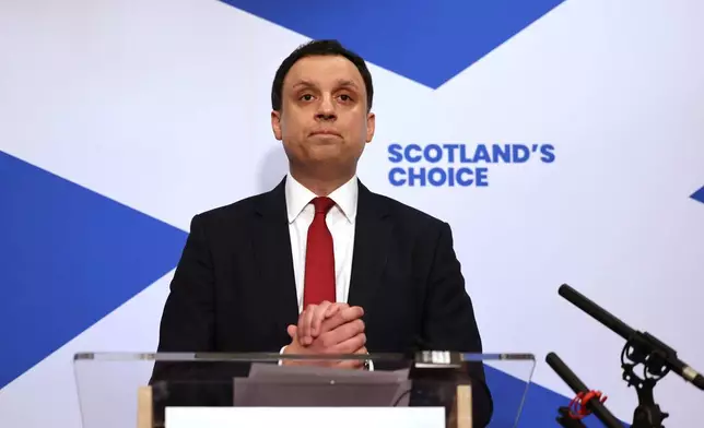 Scottish Labour leader Anas Sarwar speaks to the media during a press conference in Glasgow, Scotland, where he is calling on Keir Starmer to resign as Prime Minister, Monday Feb. 9, 2026. (Robert Perry/PA via AP)