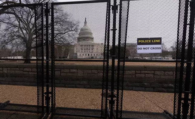 Security fencing is seen around the U.S. Capitol grounds in Washington on Monday, Feb. 23, 2026, ahead of President Donald Trump's State of the Union address on Tuesday. (AP Photo/Manuel Balce Ceneta)